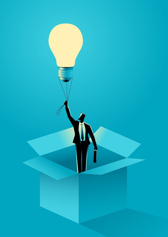 Businessman flying out of the box using light bulb air balloon Be Yourself